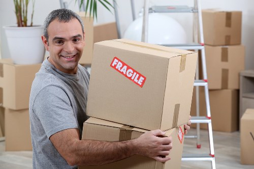 Mover handling boxes safely during a Hounslow relocation